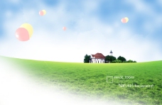 草地上的房屋和气球